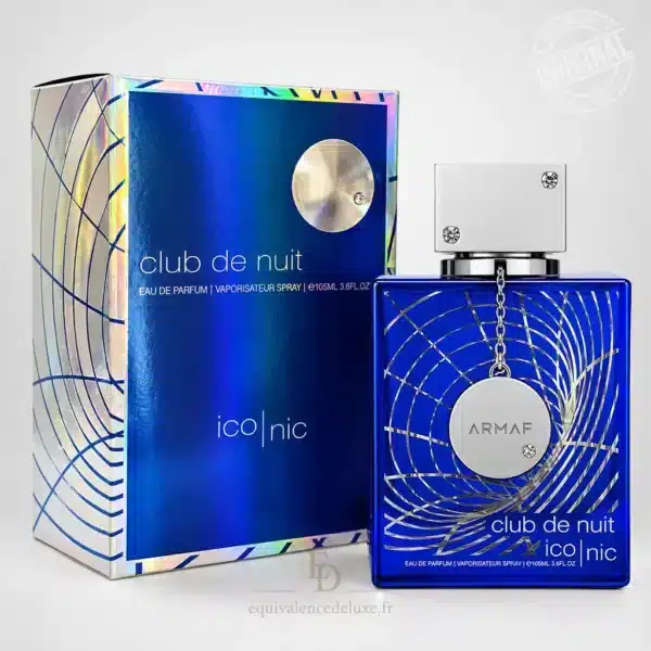 Flacon bleu du parfum Club de Nuit Blue Iconic Armaf 105 ml, avec motifs argentés et bouchon métallique, présenté dans un décor luxueux bleu et argent.